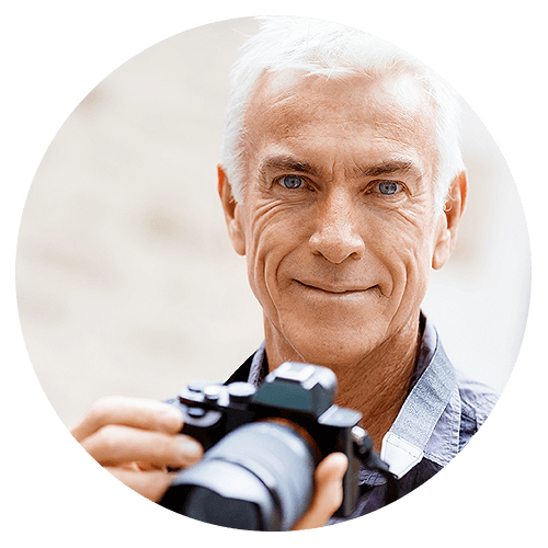 Mature Man With Camera